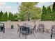 Outdoor patio featuring comfortable seating, lush greenery, and elegant brick accents for relaxed outdoor living at 6802 Carters Grove Dr, Noblesville, IN 46062