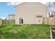 View of the home's backyard with a sliding glass door that leads to the house at 693 Cembra Dr, Greenwood, IN 46143