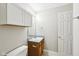 Bright bathroom featuring a single sink vanity, medicine cabinet and a tiled floor at 693 Cembra Dr, Greenwood, IN 46143