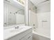 Bathroom with a white vanity and sink, mirror, and a shower with a tub at 693 Cembra Dr, Greenwood, IN 46143