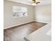Bedroom featuring hardwood floors and a large window for natural light at 693 Cembra Dr, Greenwood, IN 46143