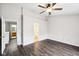 Neutral bedroom with hardwood floors, ceiling fan, and ensuite bathroom access at 693 Cembra Dr, Greenwood, IN 46143