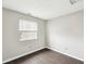 A bedroom featuring wood-look flooring and a window at 693 Cembra Dr, Greenwood, IN 46143