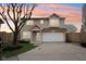 Charming two-story home with a well-manicured lawn and a two car garage at 693 Cembra Dr, Greenwood, IN 46143
