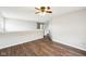 Spacious living area with hardwood floors, neutral walls, and natural lighting at 693 Cembra Dr, Greenwood, IN 46143