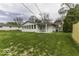 A home with backyard features well-maintained grass and a back porch at 7144 Lockwood Ln, Indianapolis, IN 46217