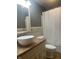 Bathroom featuring a modern vessel sink, neutral vanity, and shower-tub combination with a curtain at 7144 Lockwood Ln, Indianapolis, IN 46217