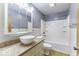 A traditionally styled bathroom offers tiled walls, and a large vanity at 7144 Lockwood Ln, Indianapolis, IN 46217