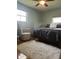 This bedroom features a ceiling fan, a rug, chair, and queen bed at 7144 Lockwood Ln, Indianapolis, IN 46217