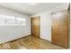 This is a basic bedroom with hardwood floors, natural light, and closet at 7144 Lockwood Ln, Indianapolis, IN 46217