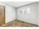 An efficient bedroom is complete with hardwood floors, window, and closet at 7144 Lockwood Ln, Indianapolis, IN 46217