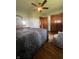 This bedroom features a ceiling fan, a rug, chair, and queen bed at 7144 Lockwood Ln, Indianapolis, IN 46217