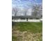 Inviting one-story home with green lawn, brick facade, an attached garage and a driveway at 7144 Lockwood Ln, Indianapolis, IN 46217