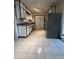 Bright kitchen with tile floors, ample cabinet space, and updated appliances at 7144 Lockwood Ln, Indianapolis, IN 46217