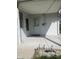 This covered porch, adorned with sleek solar lights, has two doors for easy access to the home's interior at 7144 Lockwood Ln, Indianapolis, IN 46217