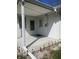 This covered porch, adorned with sleek solar lights, has two doors for easy access to the home's interior at 7144 Lockwood Ln, Indianapolis, IN 46217