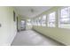 The bright sunroom has multiple windows and a door at 7144 Lockwood Ln, Indianapolis, IN 46217