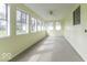 An airy sunroom has multiple windows that provide ample natural light at 7144 Lockwood Ln, Indianapolis, IN 46217