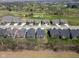 An aerial view of homes in a neighborhood near a golf course on a sunny day at 7210 Covington St, Lebanon, IN 46052