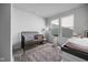 Cozy Bedroom room with a crib, area rug, and natural light from large windows at 7210 Covington St, Lebanon, IN 46052