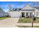 Charming home featuring a two-car garage, front porch, and well-maintained lawn at 7210 Covington St, Lebanon, IN 46052