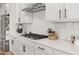 Stylish kitchen with white cabinets, modern appliances, and granite countertops at 7210 Covington St, Lebanon, IN 46052