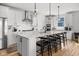 Modern kitchen with stainless steel appliances, a large island, and stylish pendant lighting at 7210 Covington St, Lebanon, IN 46052