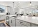 Open concept kitchen with a large island, modern appliances, and stylish pendant lighting at 7210 Covington St, Lebanon, IN 46052