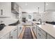 Bright kitchen featuring white cabinets, stainless steel appliances, and subway tile backsplash at 7210 Covington St, Lebanon, IN 46052