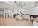 Open-concept living area with island seating, stainless appliances, and comfortable seating at 7210 Covington St, Lebanon, IN 46052