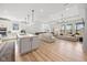 Open-concept living space with hardwood floors, recessed lighting, and expansive windows at 7210 Covington St, Lebanon, IN 46052