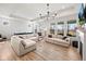 Spacious living room with large windows, hardwood floors, and comfortable seating at 7210 Covington St, Lebanon, IN 46052