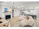 Open concept living area with fireplace, tv, and kitchen featuring pendant lighting at 7210 Covington St, Lebanon, IN 46052