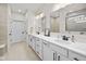 Bathroom featuring double sinks, white vanity, and walk-in shower at 7210 Covington St, Lebanon, IN 46052