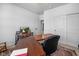 Bright home office space with a large desk, comfortable chair, and neutral decor at 7210 Covington St, Lebanon, IN 46052