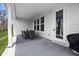 Cozy covered patio with an outdoor dining set and access to the home's interior at 7210 Covington St, Lebanon, IN 46052