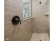 Close up of walk-in shower featuring neutral tile and a rainfall shower head at 7210 Covington St, Lebanon, IN 46052