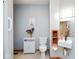 Bathroom with neutral walls, white cabinetry, a sink with a dark faucet, and a toilet at 7265 Derbyshire Dr, Cumberland, IN 46229