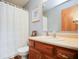 Bathroom featuring a vanity with wooden cabinets and a shower with a white curtain at 7265 Derbyshire Dr, Cumberland, IN 46229