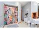 Bathroom featuring shower with floral curtain, vanity, toilet, and linen cabinet at 7265 Derbyshire Dr, Cumberland, IN 46229