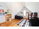 Attic bedroom featuring angled ceilings, a bed, desk, and plush toys at 7265 Derbyshire Dr, Cumberland, IN 46229