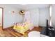 Bright, airy bedroom with cute wall decorations and a cozy bed at 7265 Derbyshire Dr, Cumberland, IN 46229