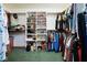 Walk-in closet with clothing racks, shelves for shoes and accessories at 7265 Derbyshire Dr, Cumberland, IN 46229