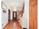 Welcoming hallway with hardwood floors and a stylish chandelier at 7265 Derbyshire Dr, Cumberland, IN 46229