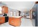 Open kitchen offers island and seamless flow into living room and breakfast nook at 7265 Derbyshire Dr, Cumberland, IN 46229