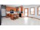 Bright kitchen offers large island, modern appliances, and plenty of natural light at 7265 Derbyshire Dr, Cumberland, IN 46229
