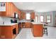 Functional kitchen with island and modern appliances, plus plenty of natural light at 7265 Derbyshire Dr, Cumberland, IN 46229