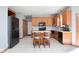 Kitchen with wood cabinets, granite countertops, a center island, and stainless steel appliances at 7265 Derbyshire Dr, Cumberland, IN 46229