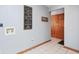 Laundry room with gray walls, tile floors, closet doors, and laundry hookups at 7265 Derbyshire Dr, Cumberland, IN 46229