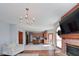 Cozy living room with fireplace and open concept into kitchen and dining areas at 7265 Derbyshire Dr, Cumberland, IN 46229